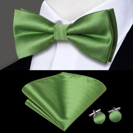 green bow ties with matching cuff links and pocket square