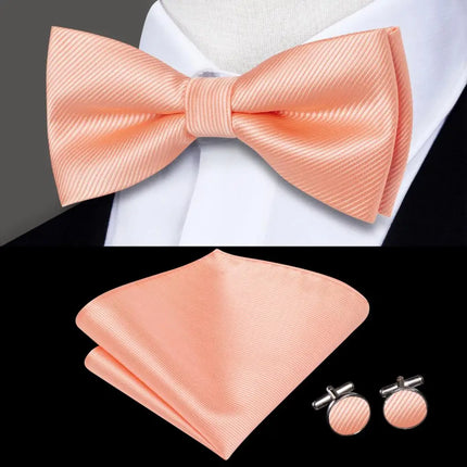 pink bow ties with matching cuff links and pocket square