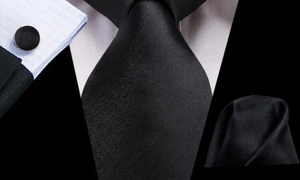 Black tie made from jacquard woven silk. Includes matching cuff links and pocket square