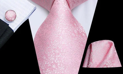Light pink floral design tie with matching cuff links and pocket square