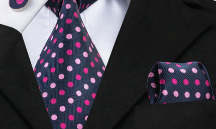 blue and pink polka dot tie with cuff links and pocket square