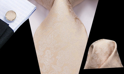 cream color paisley tie with cuff links and pocket square