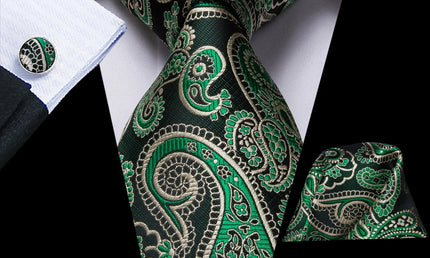 green paisley tie with cuff links and pocket square