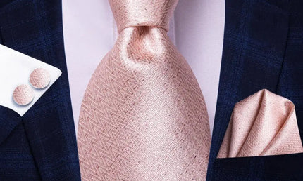 light pink geometric design tie with cuff links and pocket square