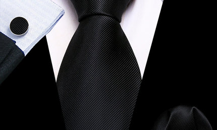 plain black tie with matching cuff links and pocket square