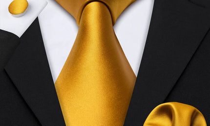 plain bright gold tie with matching cuff links and pocket square