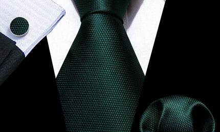 plain dark green tie with matching cuff links and pocket square