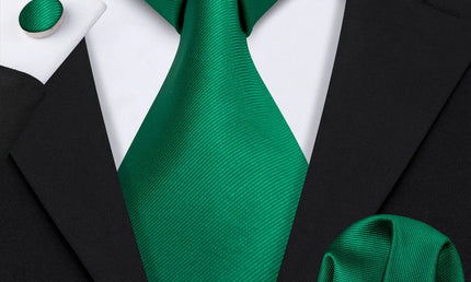 plain green textured tie with cuff links and pocket square