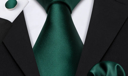 plain green tie with matching cuff links and pocket square