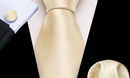 plain light gold tie with matching cuff links and pocket square