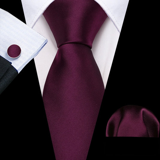 plain plum tie with cuff links and pocket square