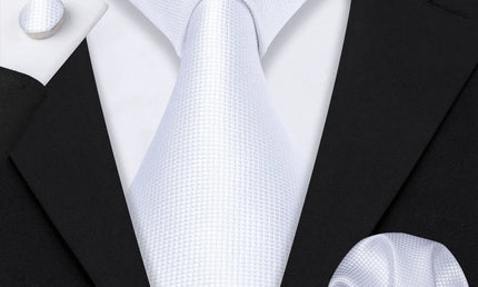plain white textured tie with cuff links and pocket square