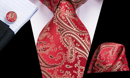 red paisley tie with cuff links and pocket square